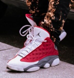 Pair of red and white basketball-style sneakers.